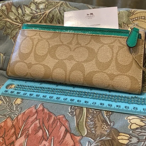 NWOT Coach Wallet in tan teal color Bags